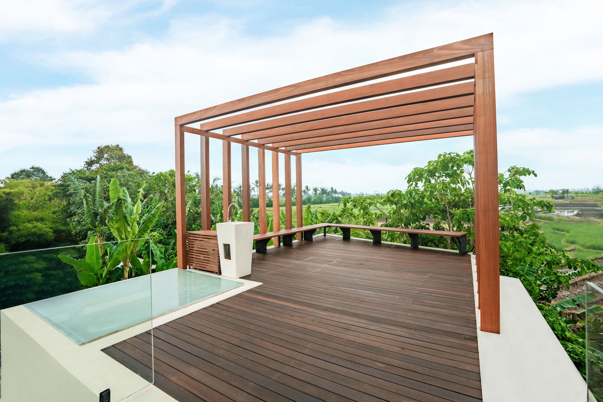 Wooden terrace with rice field views at Villa Amore Bereban Bali